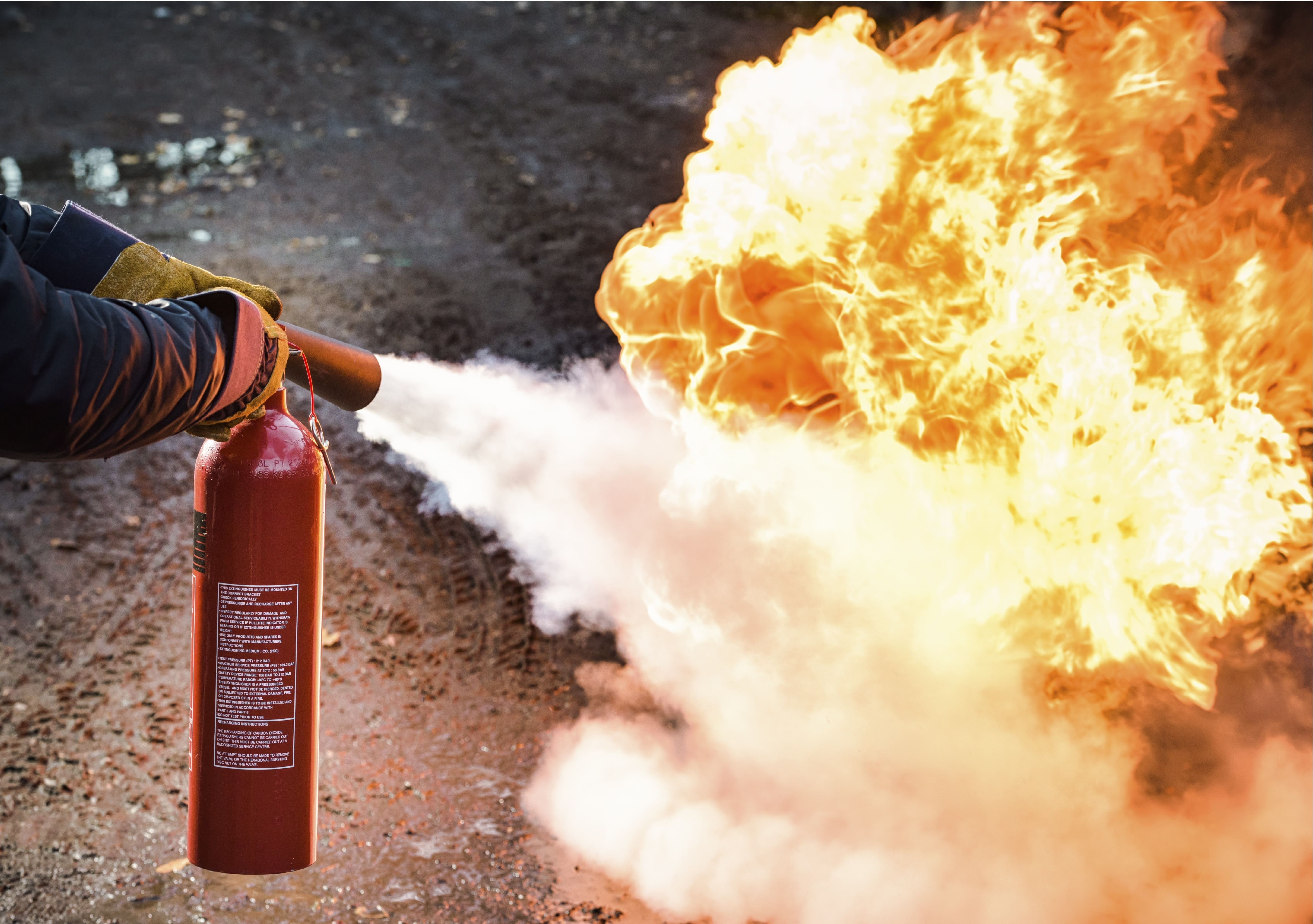 co2 fire extinguisher being used to fight fire