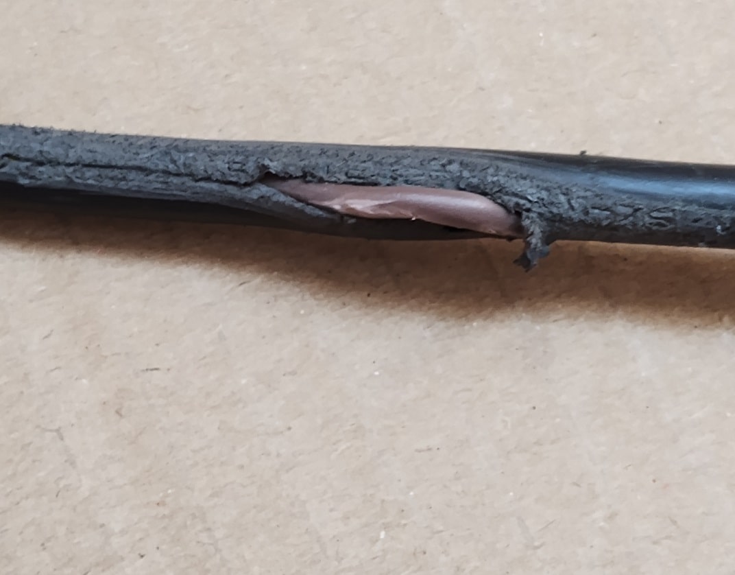 damage to an electrical flex exposing inner sheathing and copper core