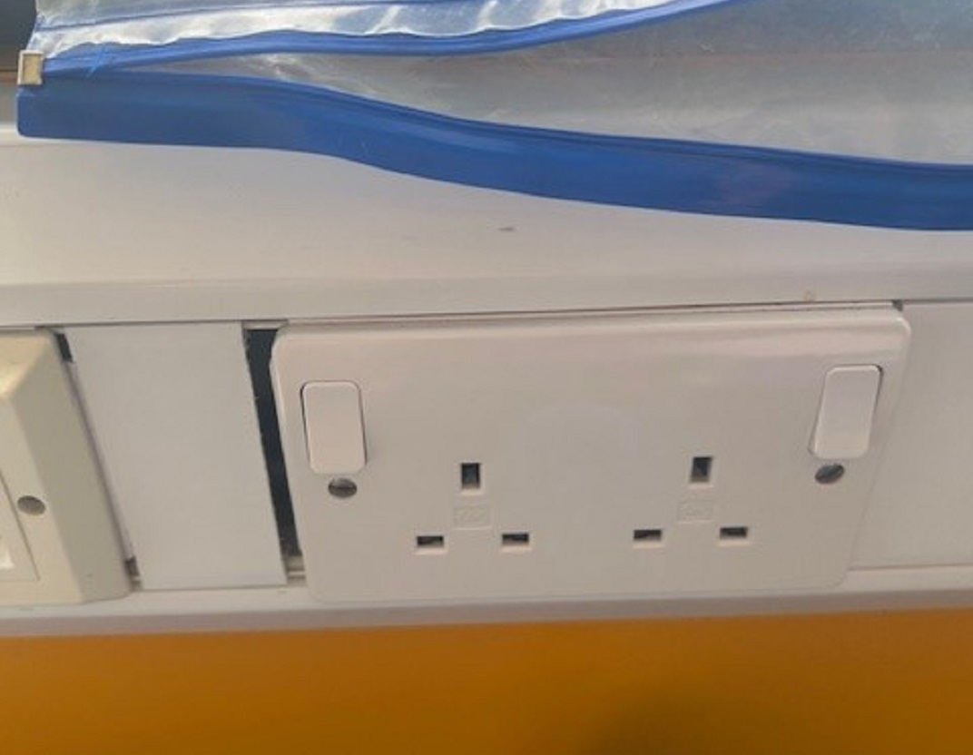 plastic trunking with gap between plastic outlet plate and infill cover.