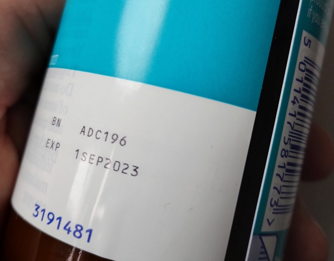 close-up of label on medincine bottle showing expiry date of 1st September 2023