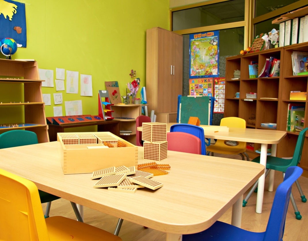 nursery classroom with several shelved storage units of varying heights