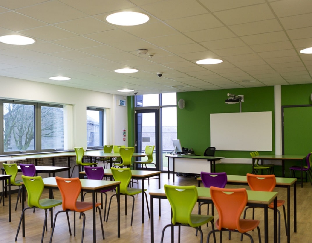 group work table in classroom obstructing fire exit