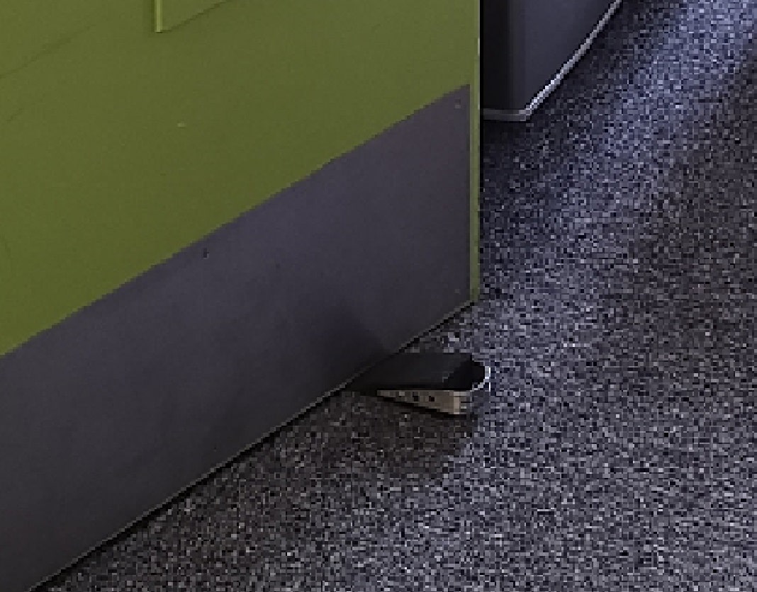 wedge holding open green fire door