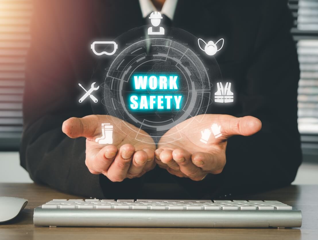 a person with cupped hands suppporting the words 'work safety' surrounded by images respresentative of the key elements of a safety management system